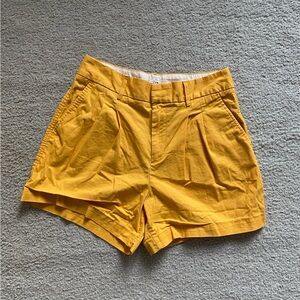 GAP High-Rise Pleated Khaki Shorts in Mustard Yellow